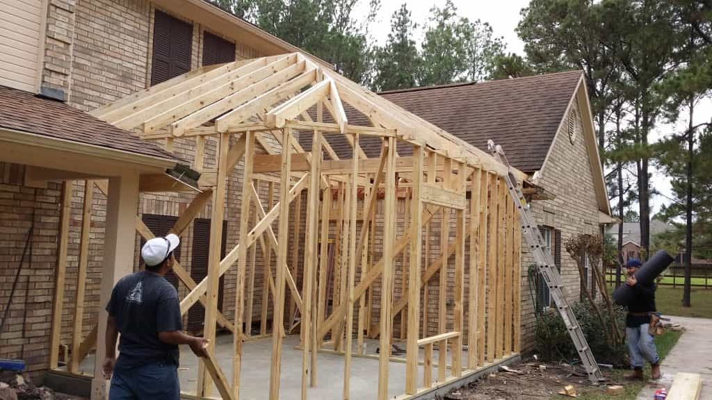 Exterior room addition with hardiplank siding windows, and a composition shingle roof.