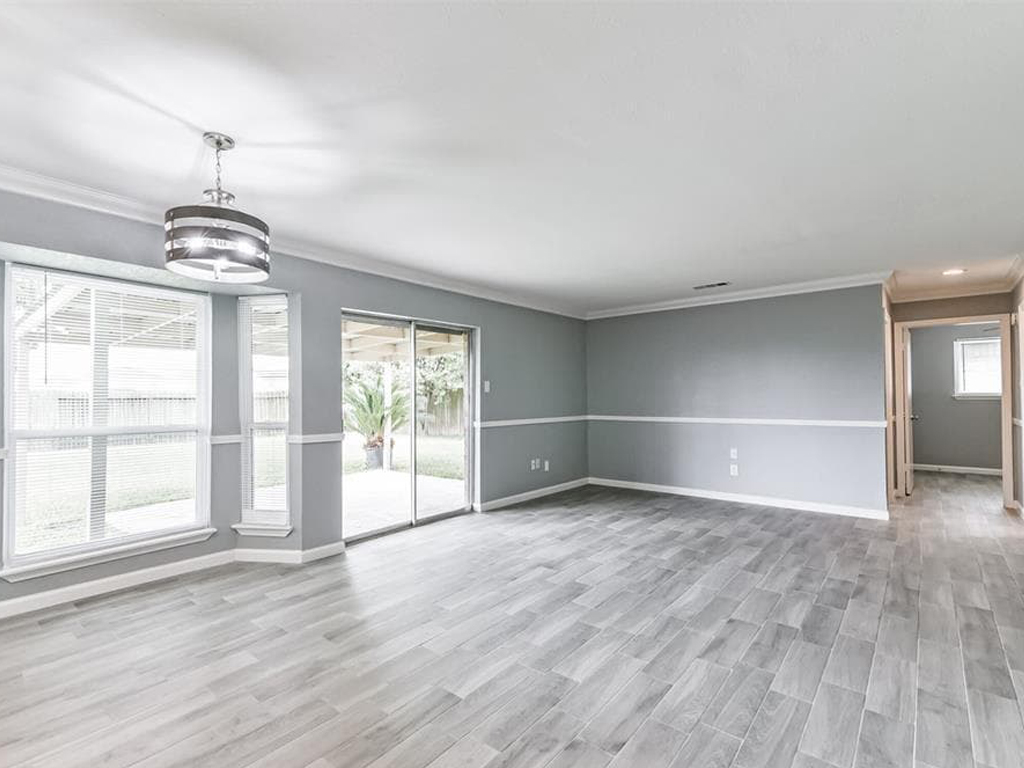 Drywall repair and whole house interior painting with white ceilings and trim and gray walls.