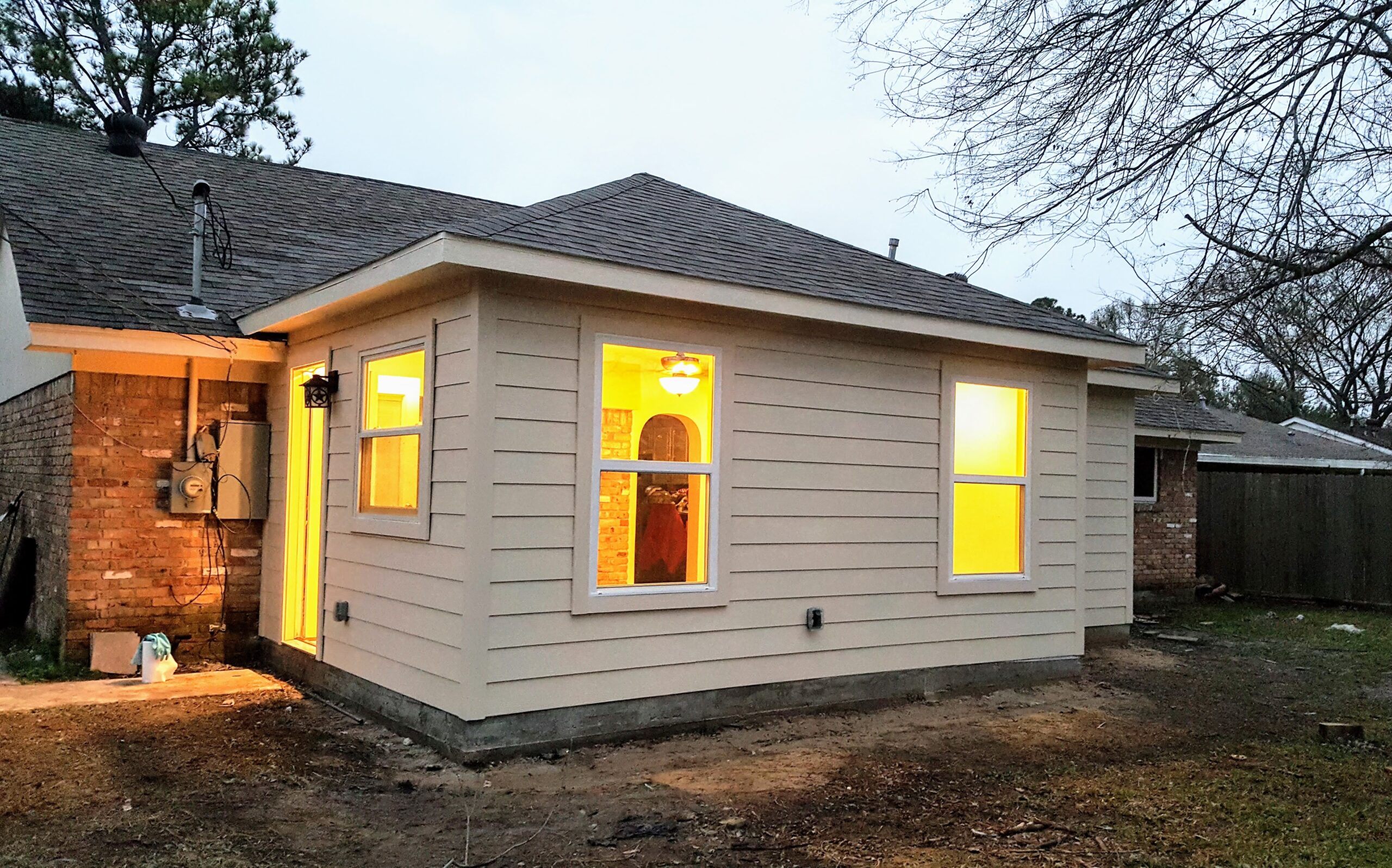 Exterior room addition with hardiplank siding and shingles in Houston, briar forest area.