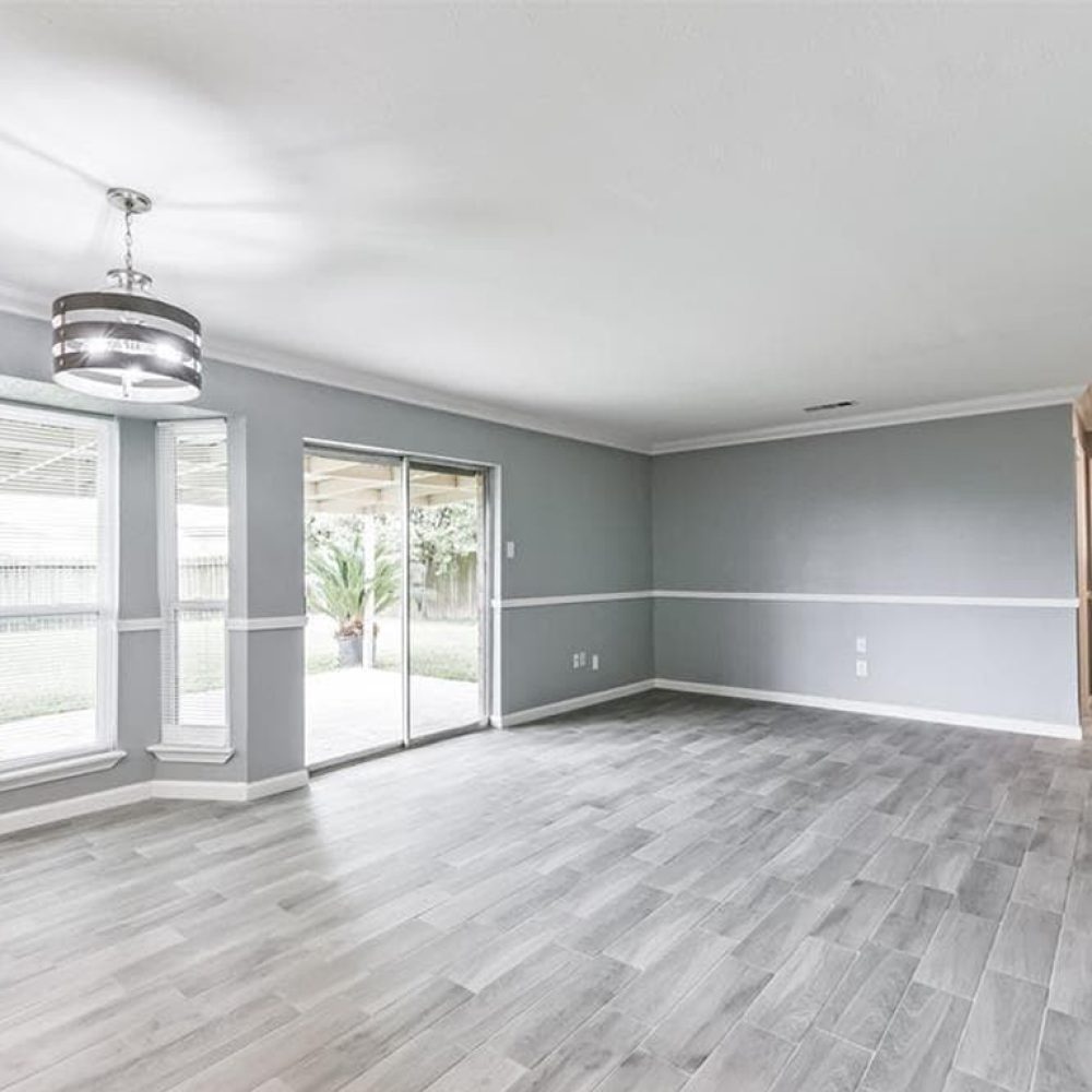 Drywall repair and whole house interior painting with white ceilings and trim and gray walls.