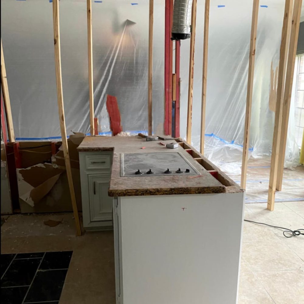 Houston remodeling contractor installing dust wall barrier before starting a kitchen remodel.