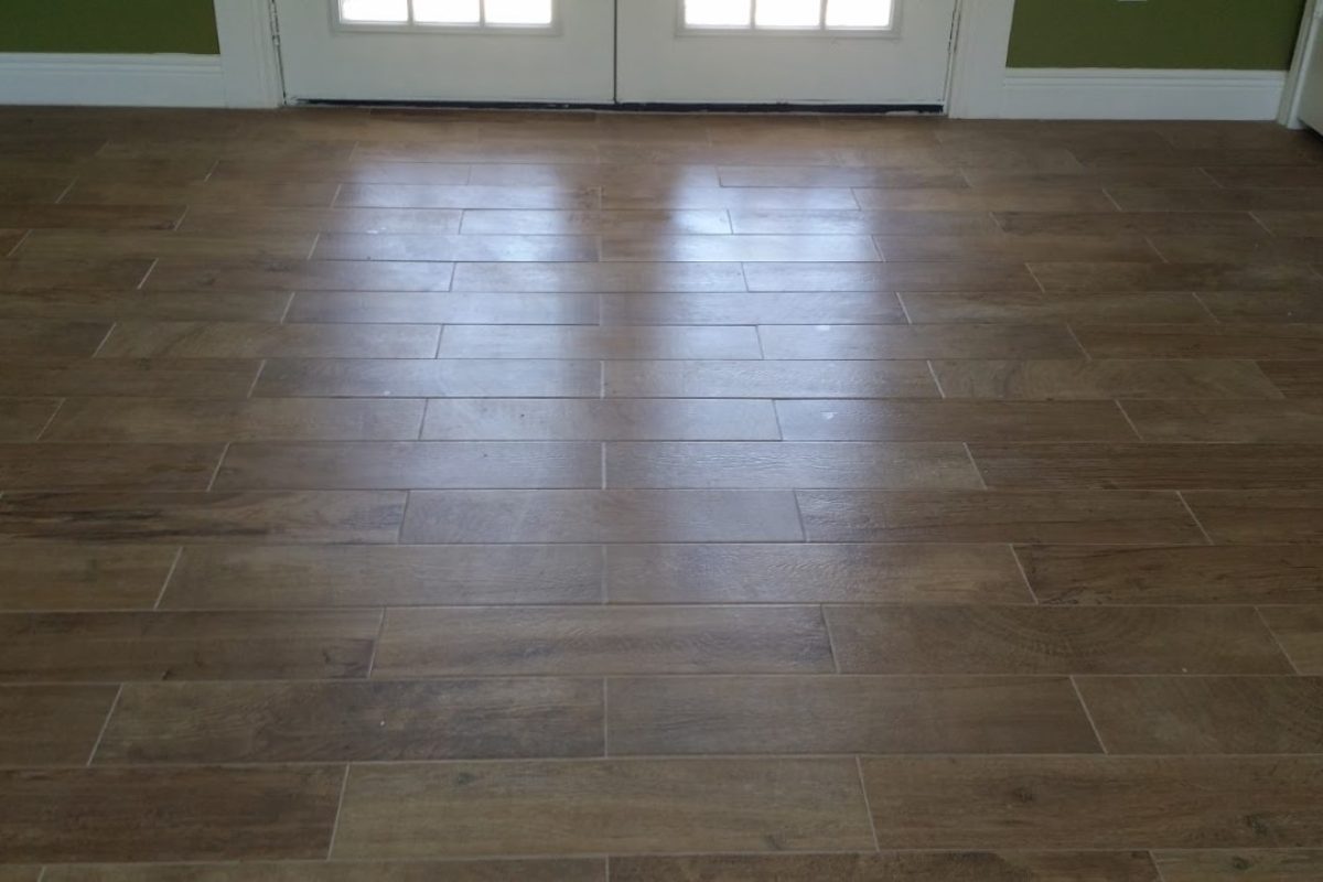 Porcelain wood look tile flooring installation for Houston home.